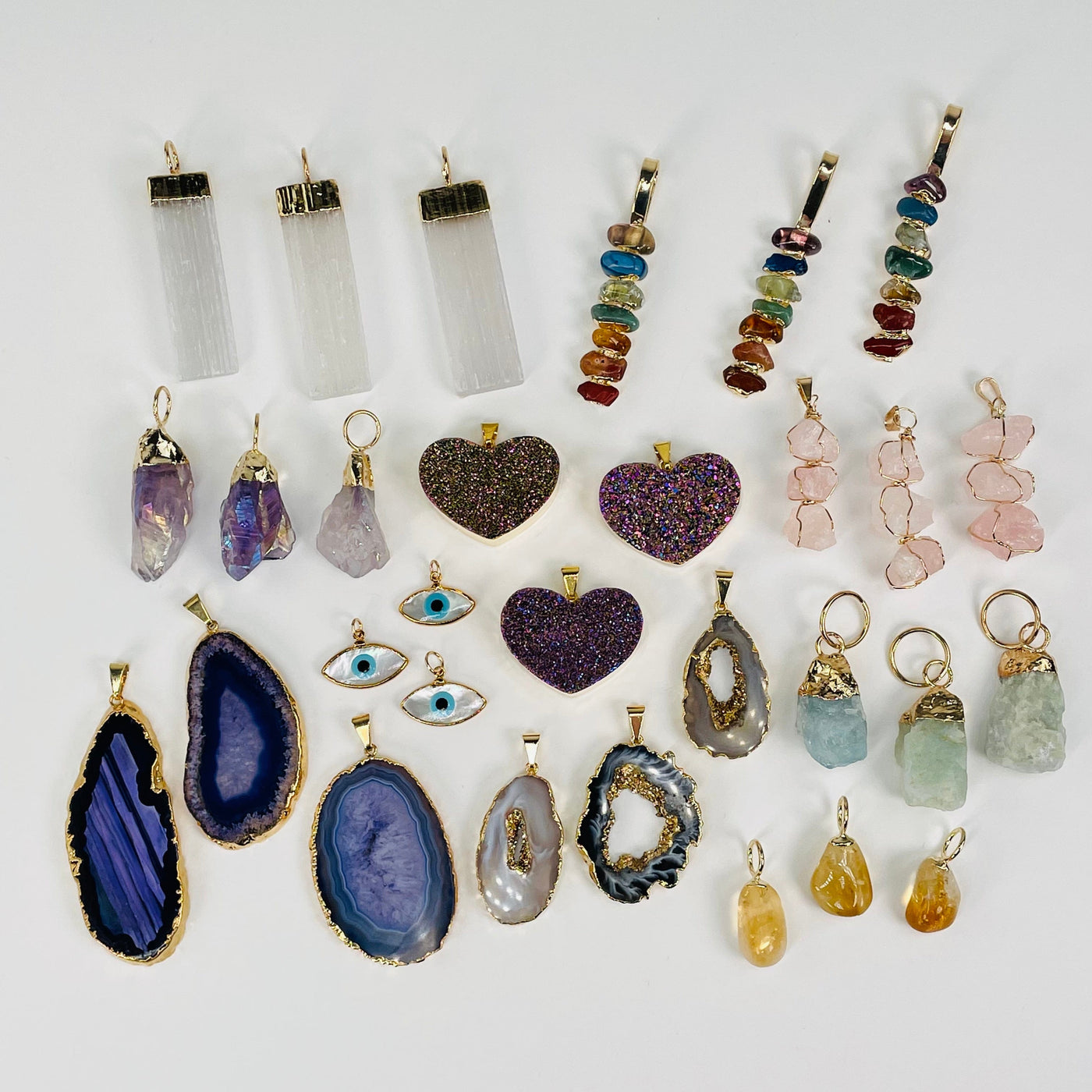 multiple pieces of each pendant displayed to show the slight differences 