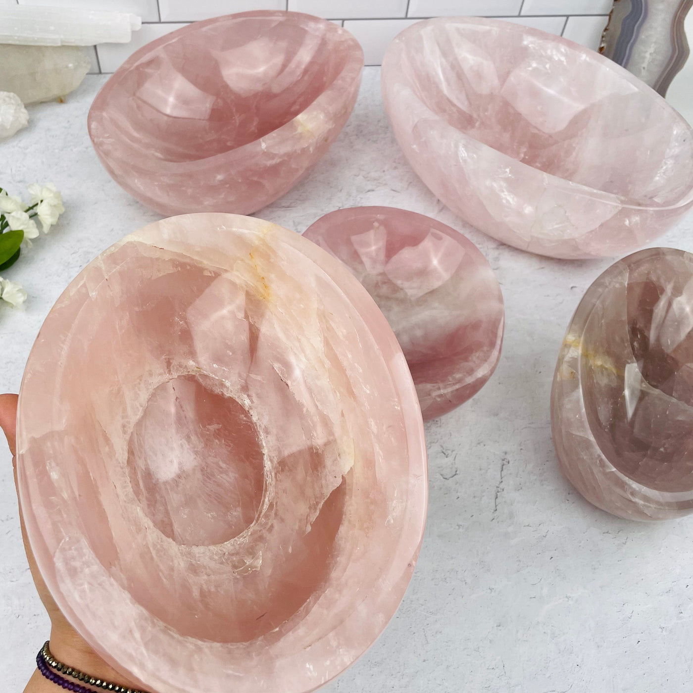 Rose Quartz Fully Polished Bowl in hand for size reference 