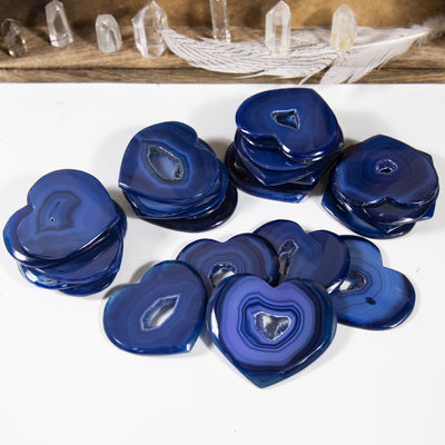 agate heart slices displayed in stacks to show  thickness and color hues