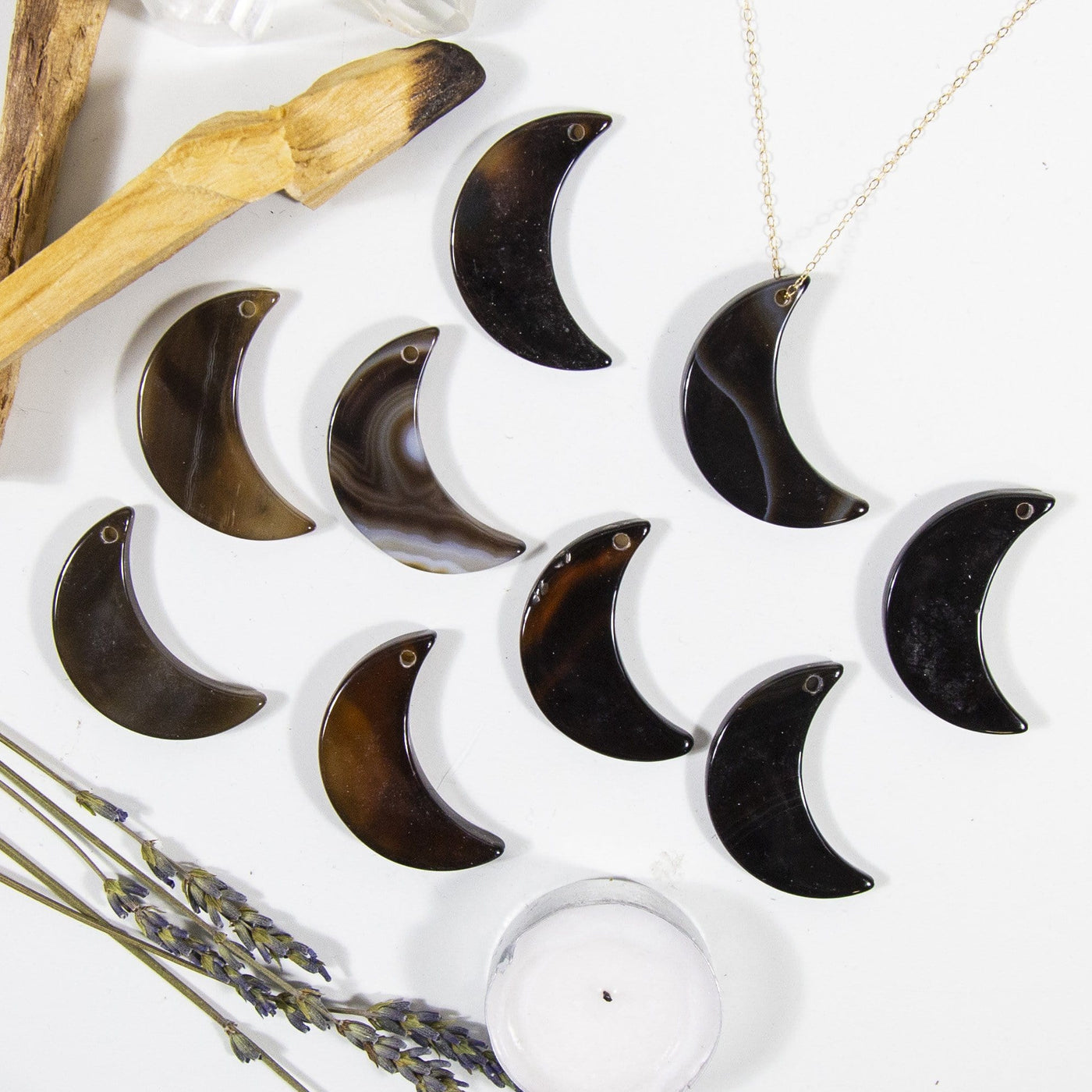 Multiple Black Drilled Half Moon Agate With Necklace on White Background