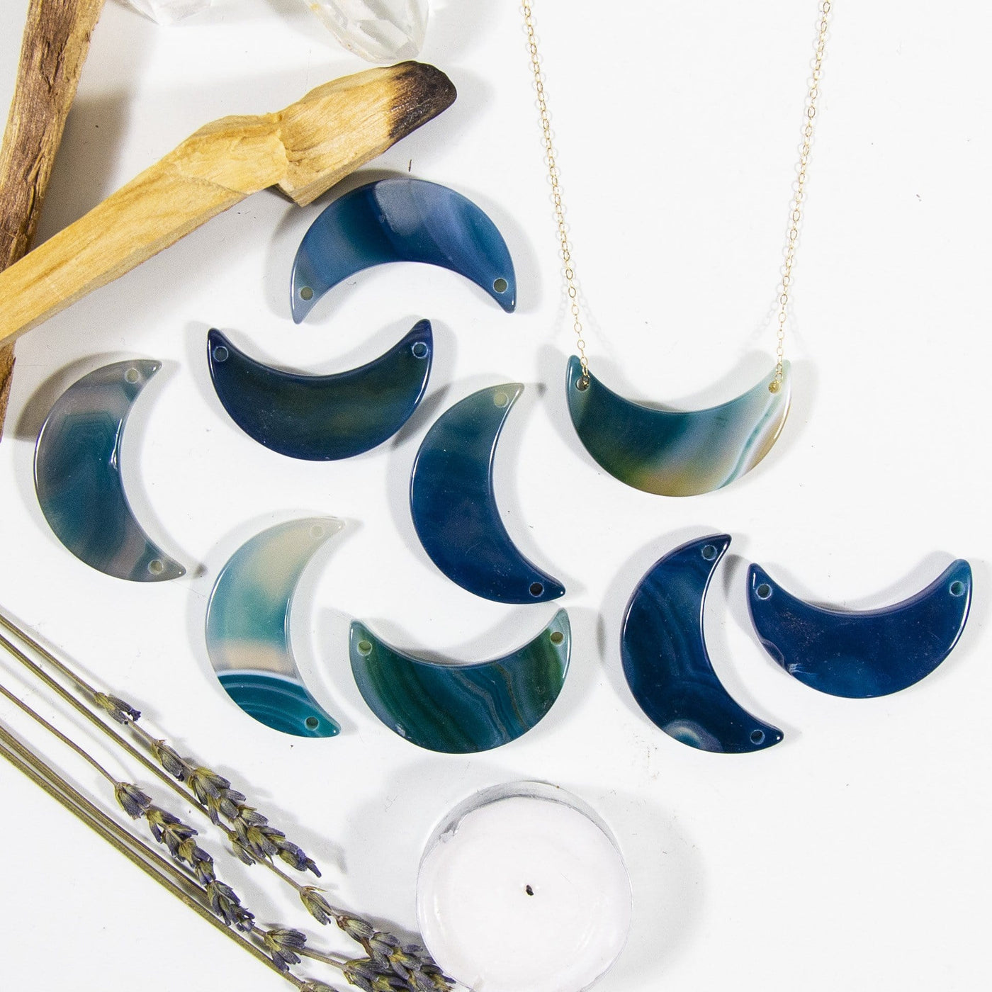 teal agate crescents on a table