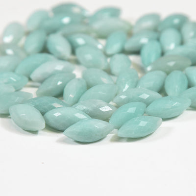 amazonite facted cabochons displayed on a white background.