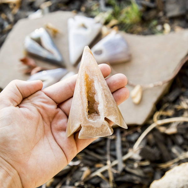 Agate Druzy Arrowhead Shape in a hand.