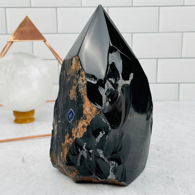 Black Obsidian Semi Polished Point displayed as home decor 