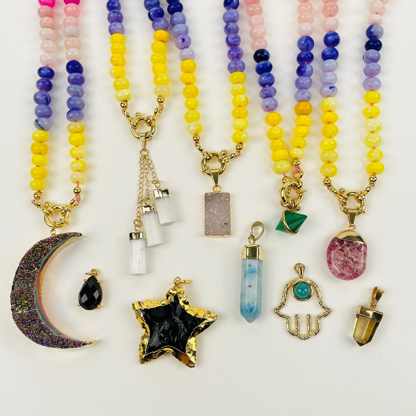necklaces displayed with pendant charms 
