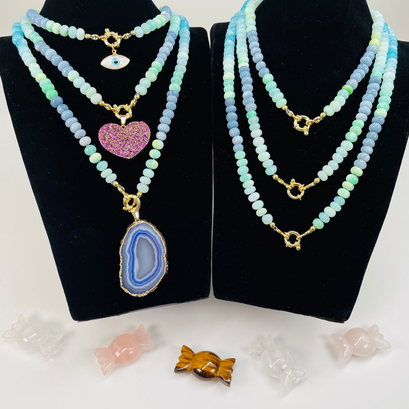 blue toned opal candy necklaces displayed to show the differences in the sizes and color shades 