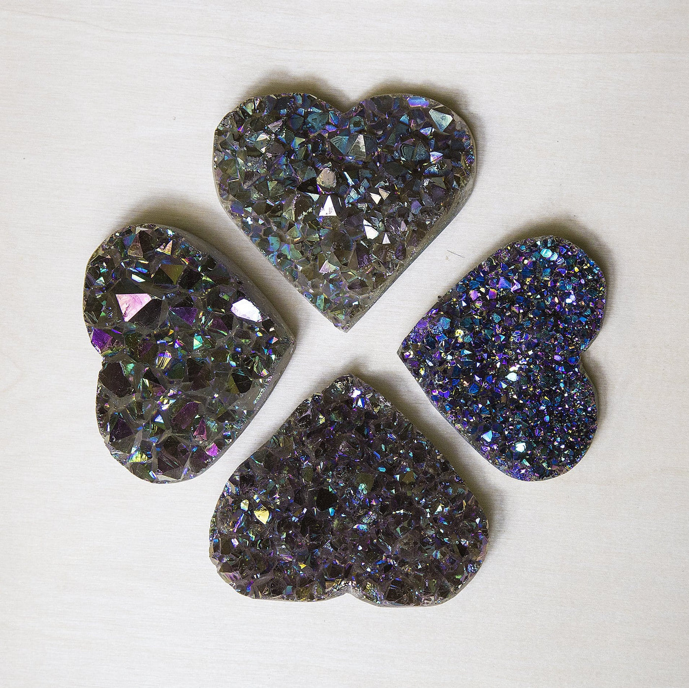 4 titanium hearts on a light background