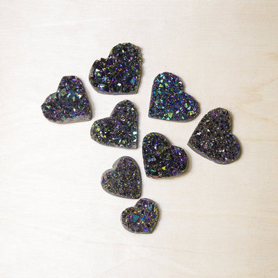 overhead view of several titanium hearts on a light background