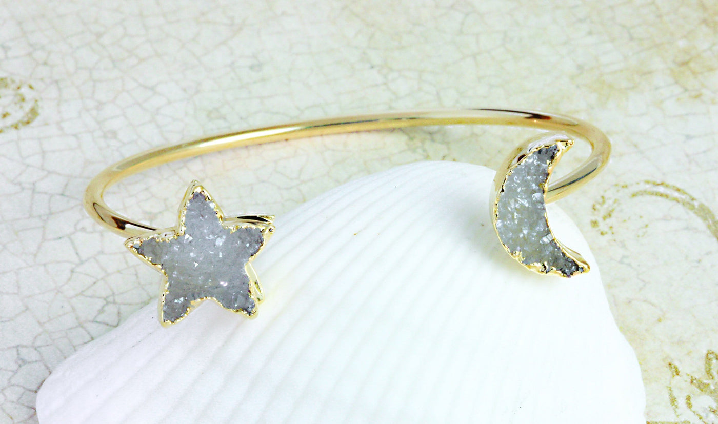 moon and star gold plated bracelet on white background