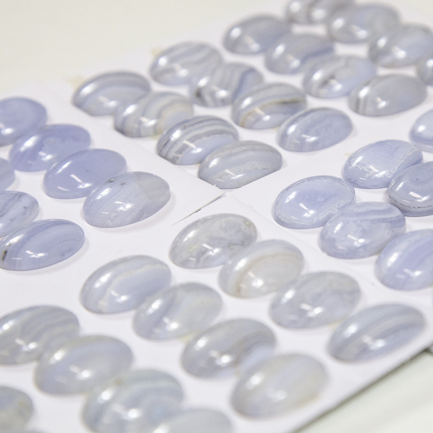 side view of the Blue Lace Agate Oval Cabochons for thickness reference