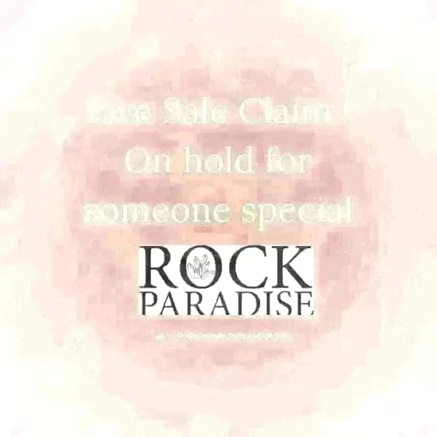 A pink background with the following written on it  "Live Sale Claim! On Hold for someone special"  Rock Paradise logo and instagram @_rockparadise_