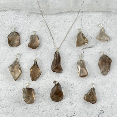 pendants displayed to show the differences in the sizes and color shades 