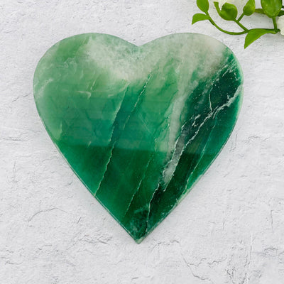 green aventurine heart displayed as home decor