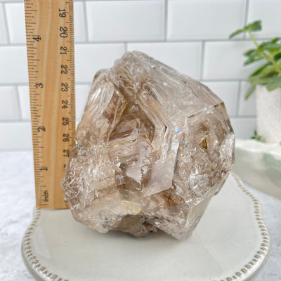 Herkimer Diamond next to a ruler for size reference 