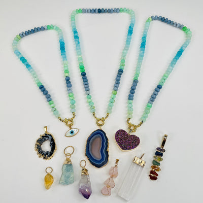necklaces displayed with the charms 
