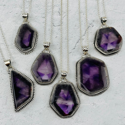 multiple pendants displayed to show the differences in the pendant sizes 