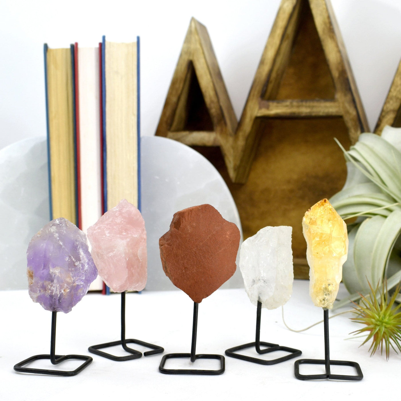 Natural Crystal Decor - Rough Stone on Metal Stand - 5 in a row on a table
