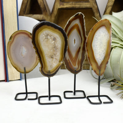 Four of the natural agate on metal stand are being shown in this picture. 