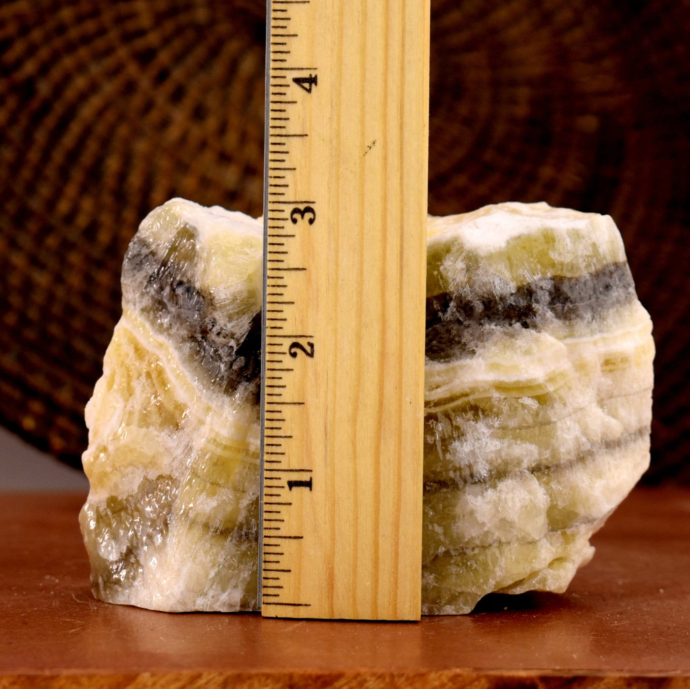 Mexican Onyx Rough Stone next to a ruler for size reference