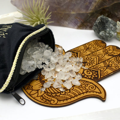 Energetic Pillow filled with crystal tumbled stones on white background.