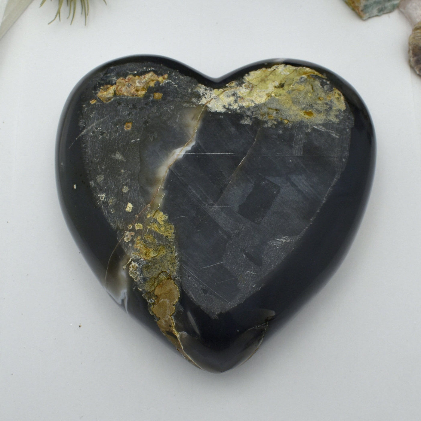 Back side view of Agate Druzy Polished Heart (DOOAK-S24-18) with a white background.