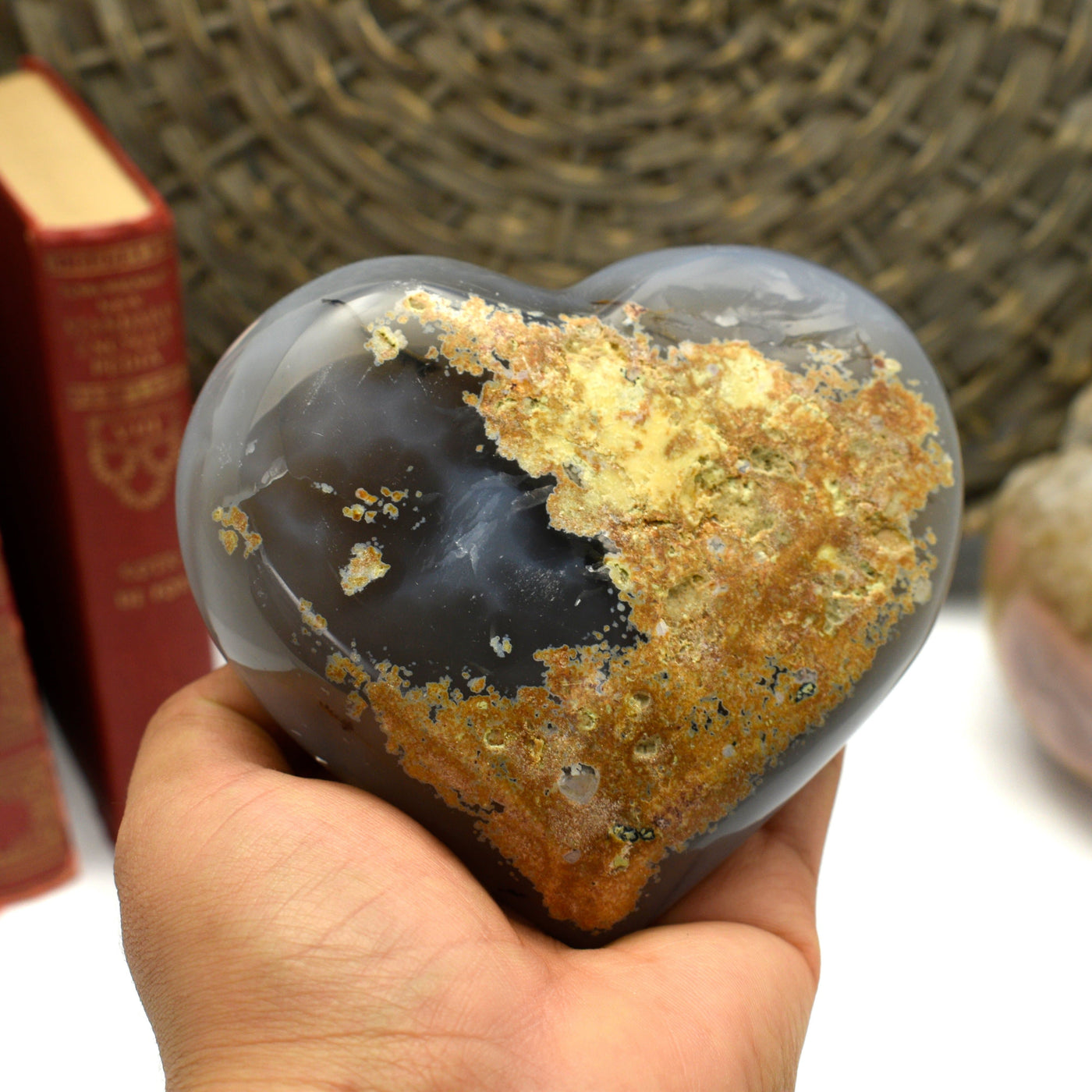 Natural Agate Druzy Heart in a hand showing the back