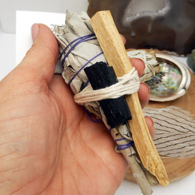 sage bundle with black tourmaline in hand for size reference and possible variation