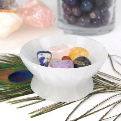 selenite pedestal bowl on display with stones (not included with purchase)