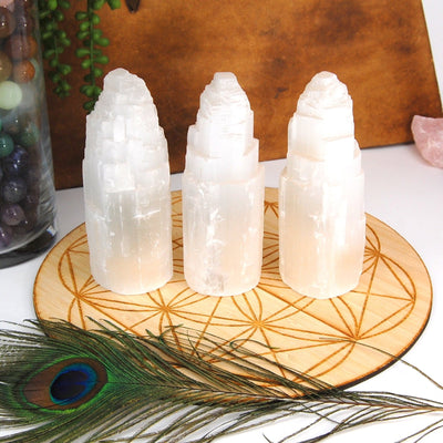 three selenite raw tower lights on display for possible variations 