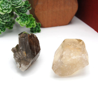 side view of both smokey quartz point options for thickness