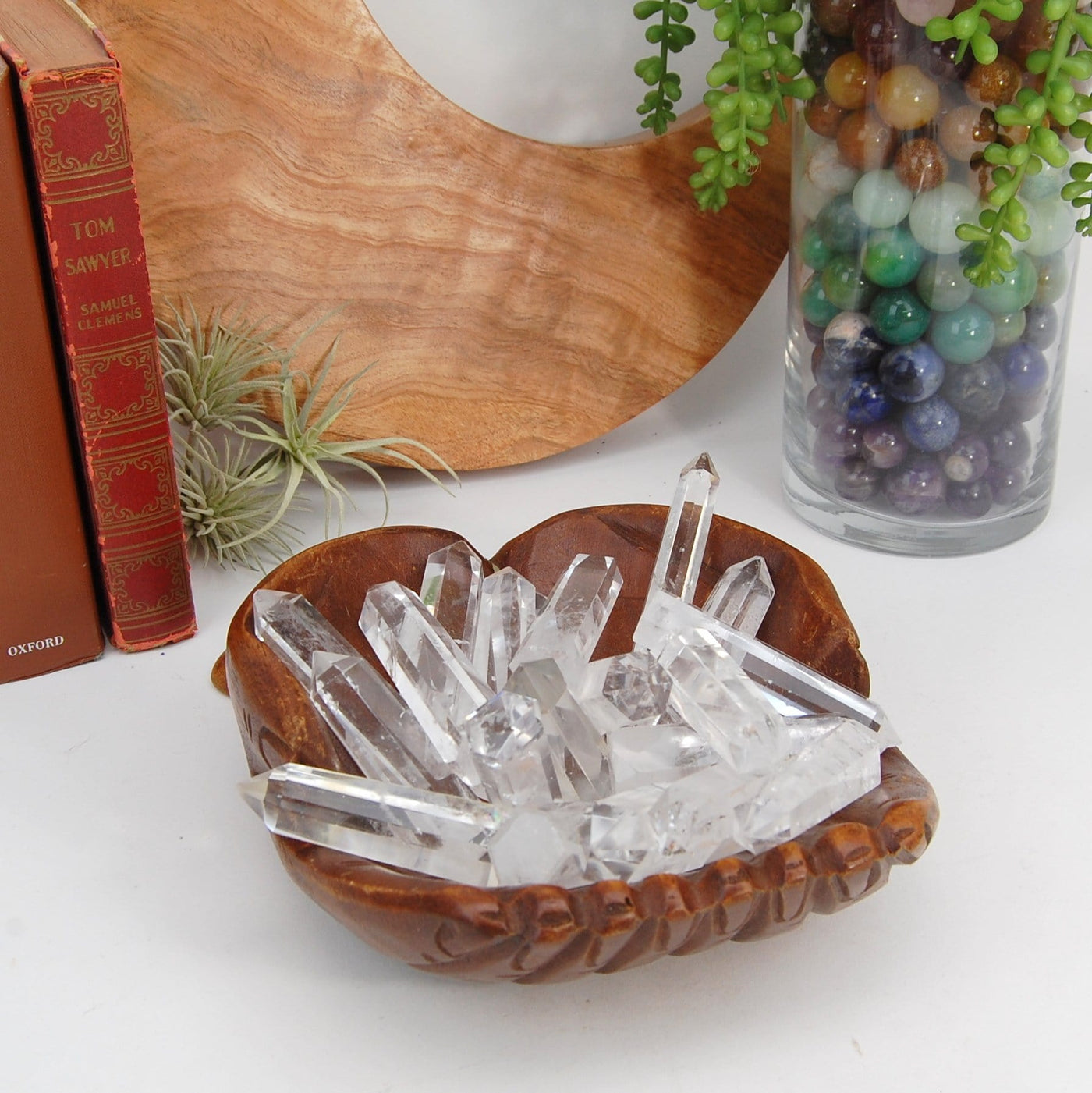 Crystal Quartz Obelisks in a hand bowl with decorations in the background
