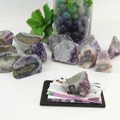 multiple Amethyst Stalactite Paper Weights to show various formations, patterns, colors, and natural inclusions