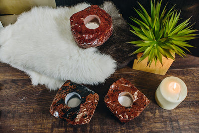 3 coffee obsidian candle holders on a wood background