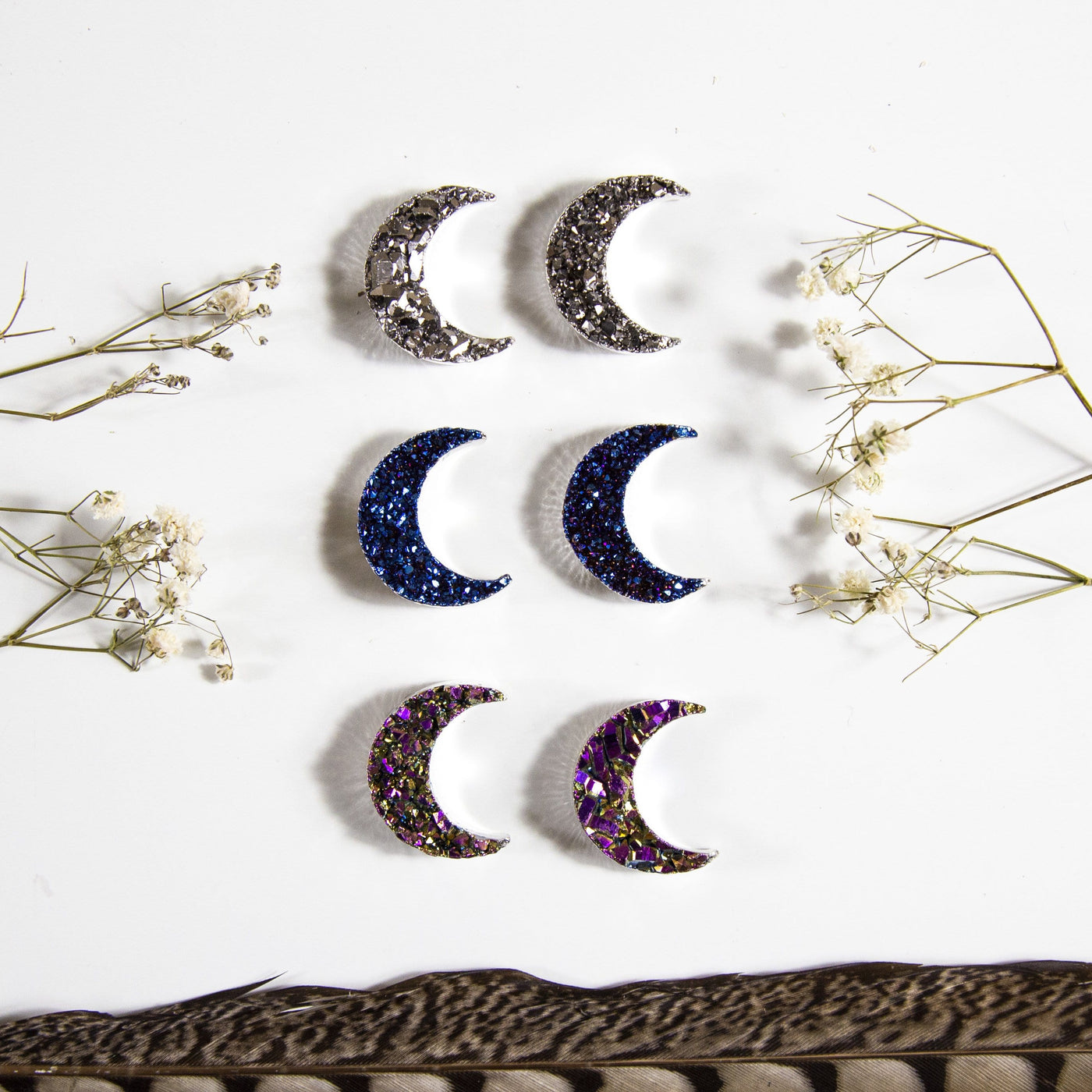 6 amethyst moons with titanium coating with decorations in the background