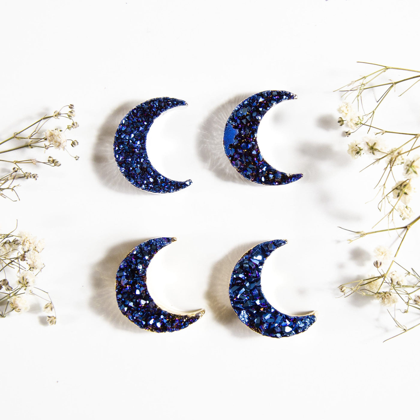 4 amethyst moons with blue titanium coating on white background