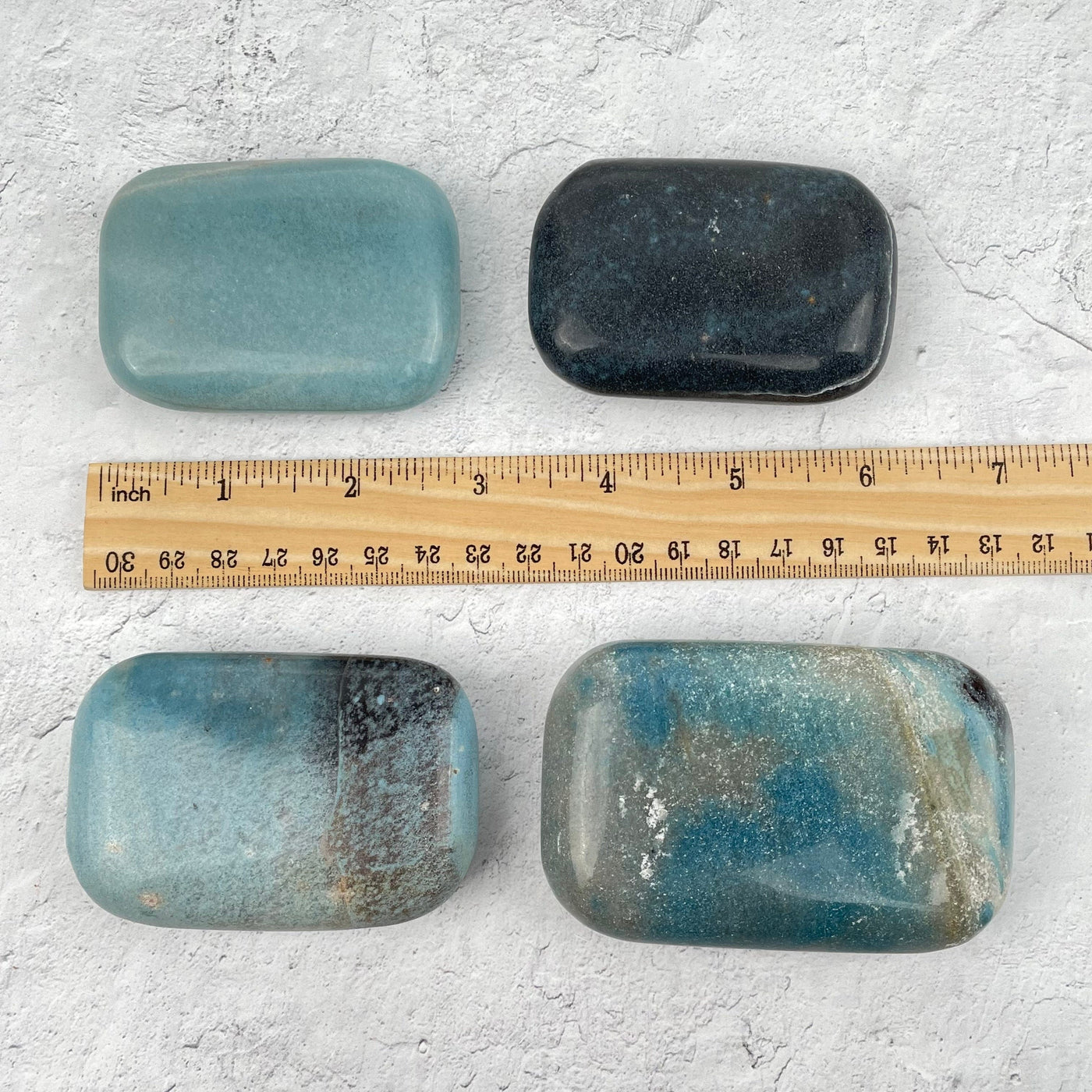 Trolleite Palm Stone - Worry Stone next to a ruler for size reference 
