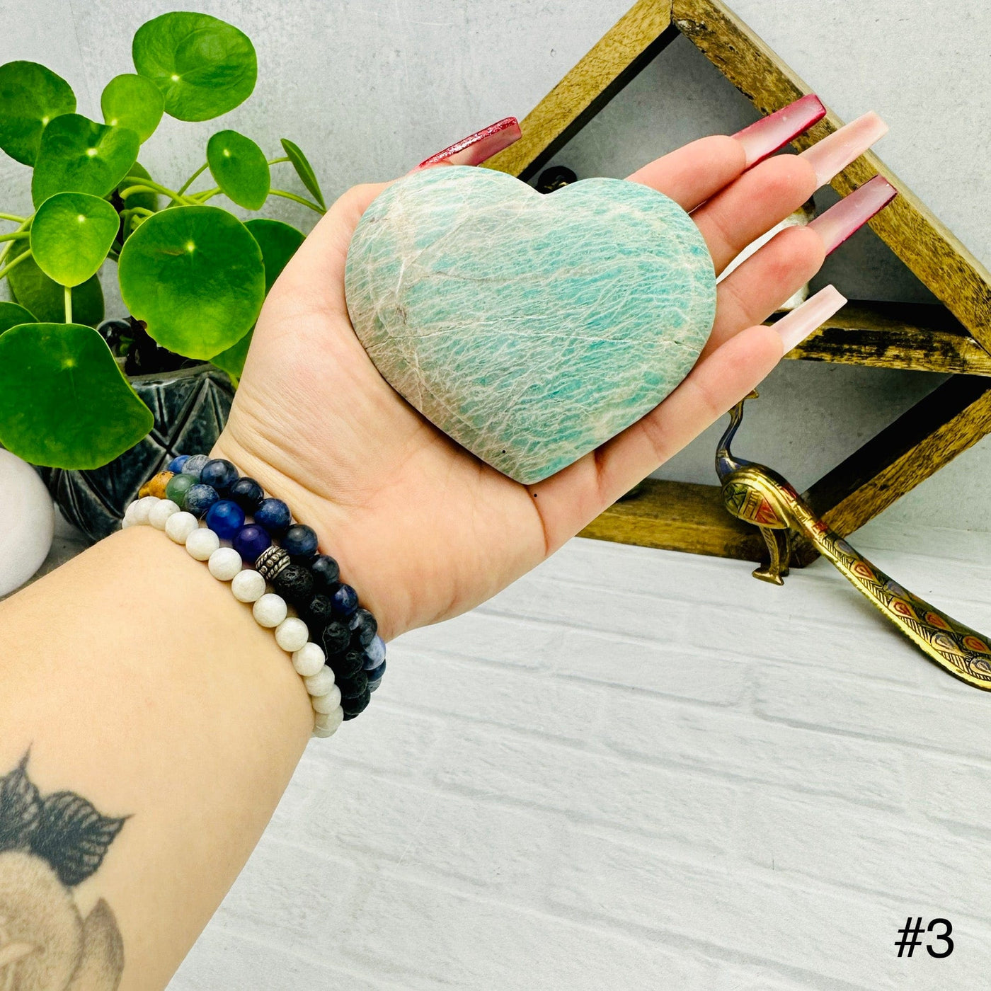 Polished Amazonite Heart - YOU CHOOSE - choice number three close up view with hand for size refence