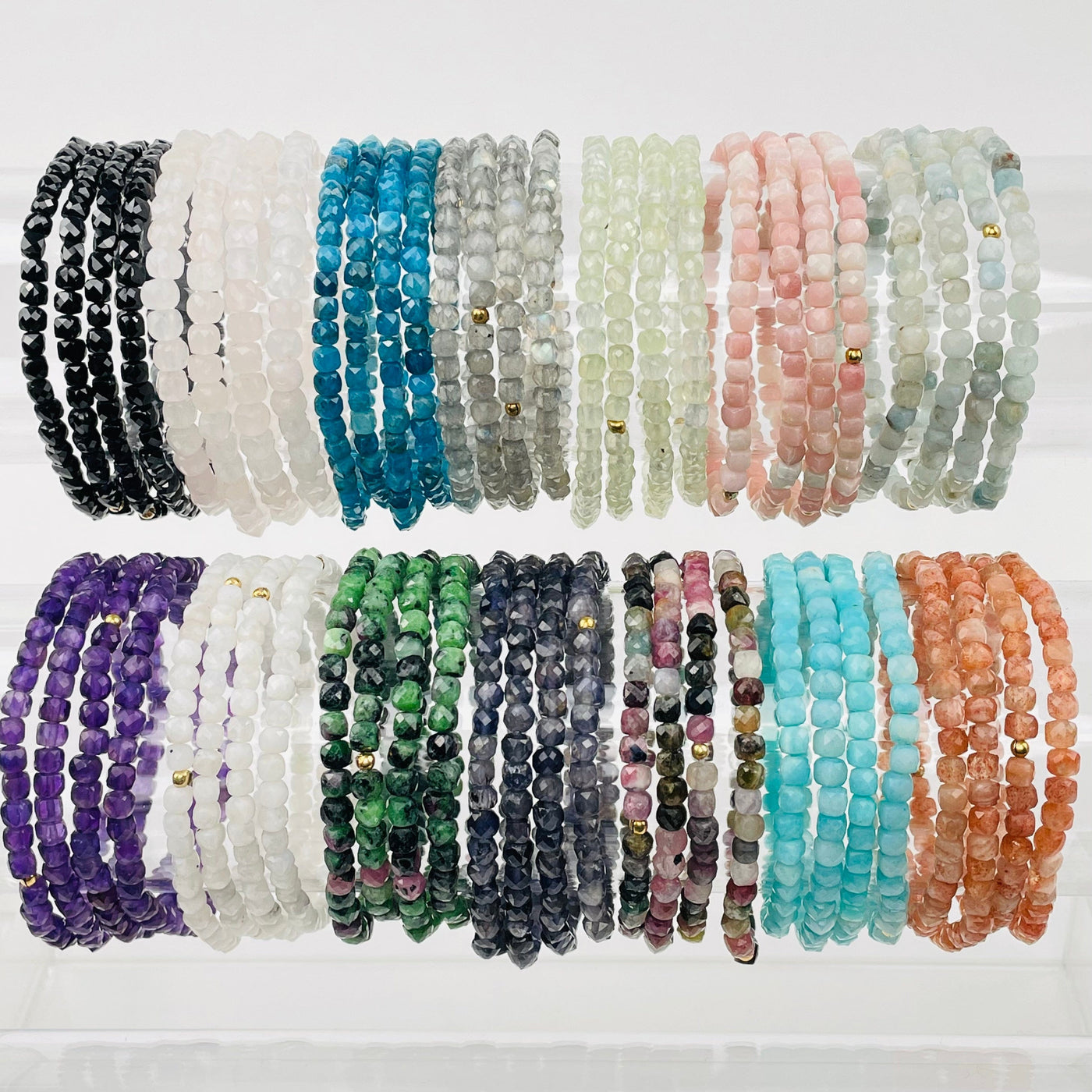 multiple bracelets displayed next to each other to show the differences in the size and color shades 