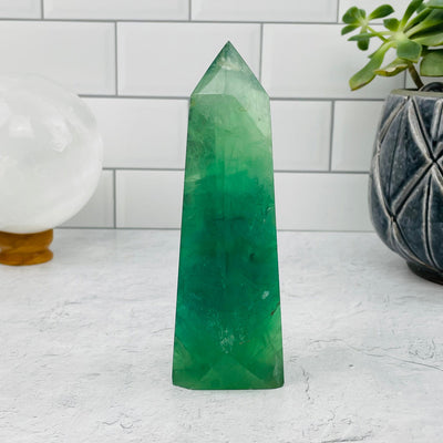 Green Fluorite Point displayed as home decor 