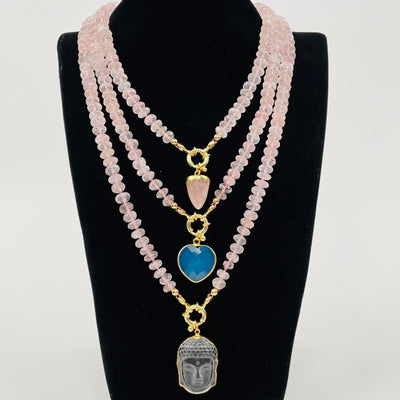 faceted rose quartz necklaces displayed with candy charms 