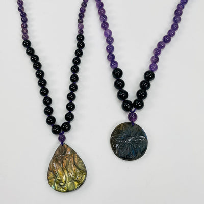 necklaces displayed to show the differences in the bead sizes 