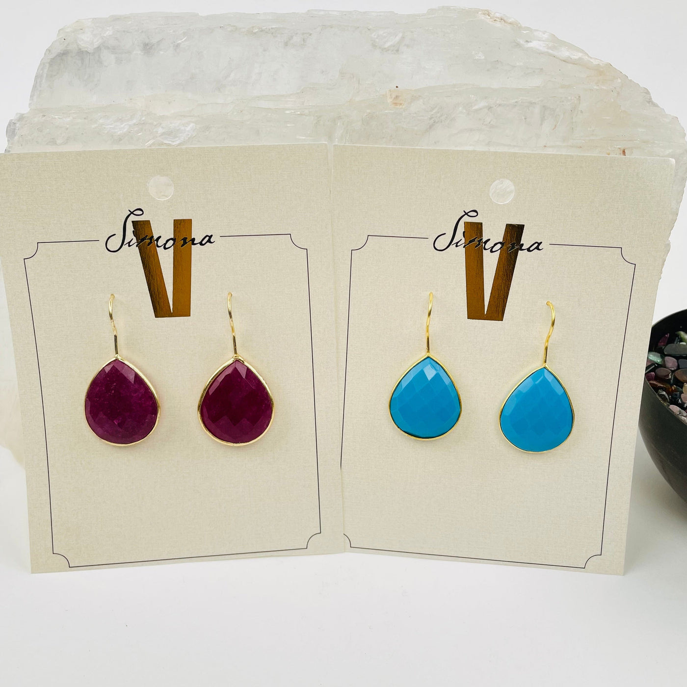 tear drop style earrings displayed to show the differences in the gemstone types 