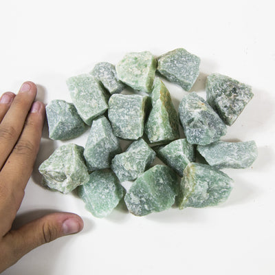 green quartz chunks displayed on white background
