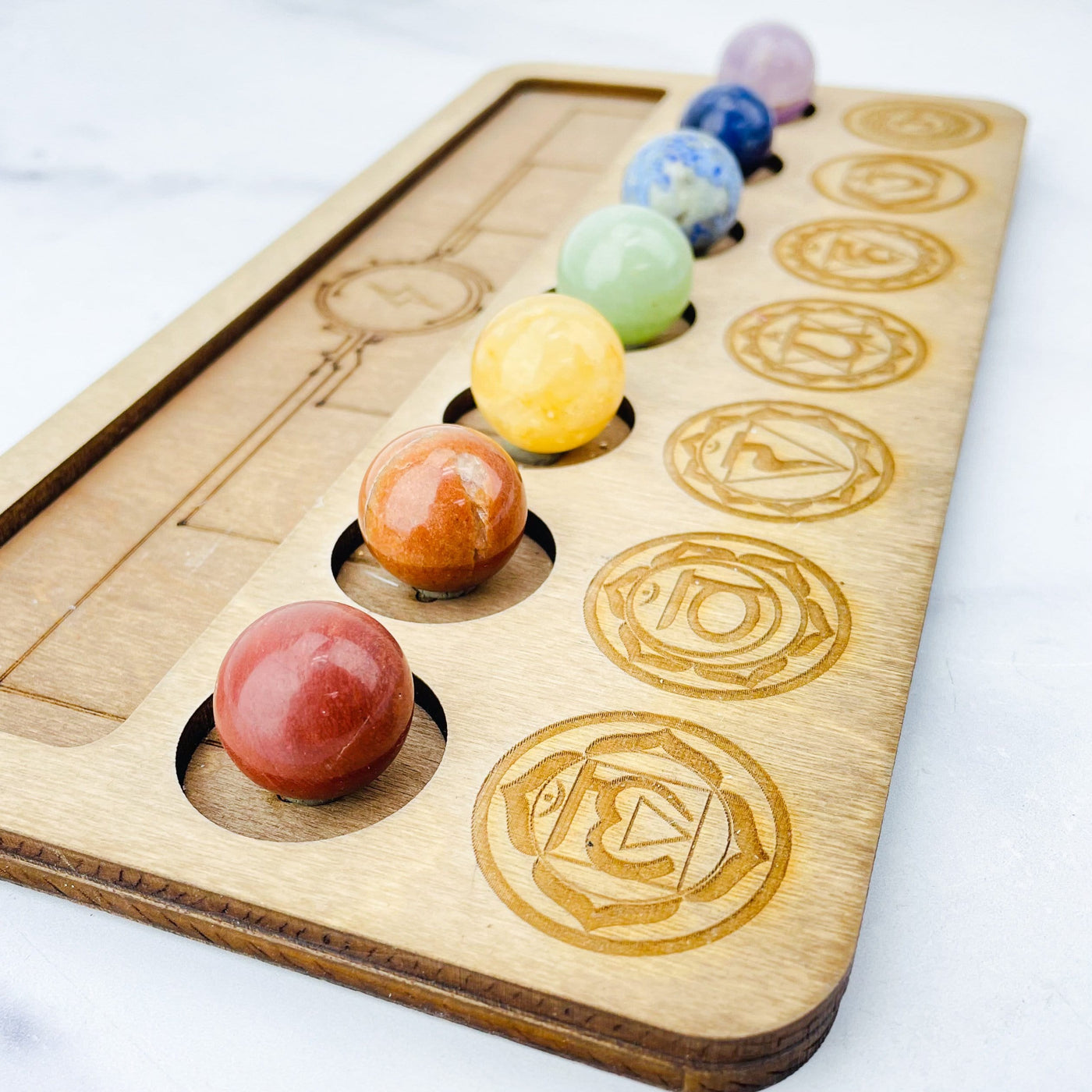 Chakra Sphere Set laid out on a board