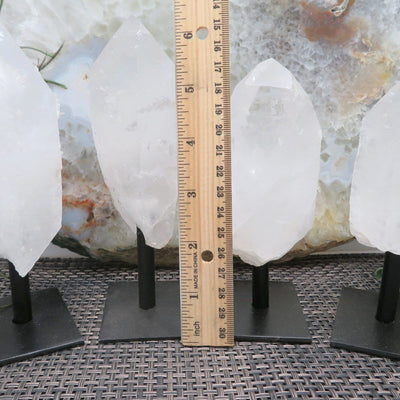 crystals next to a ruler for size reference 