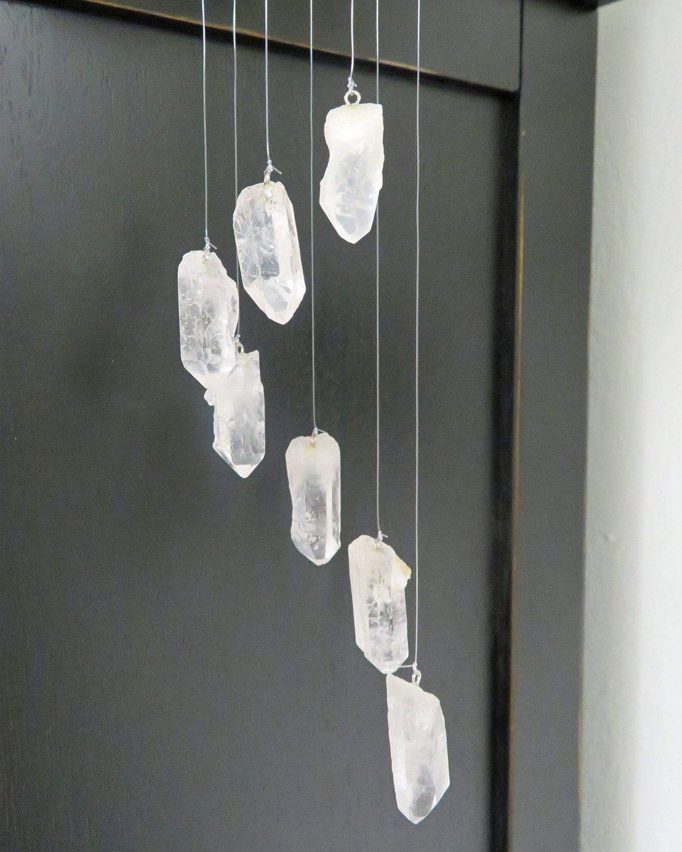 up close shot of crystal points on windchime