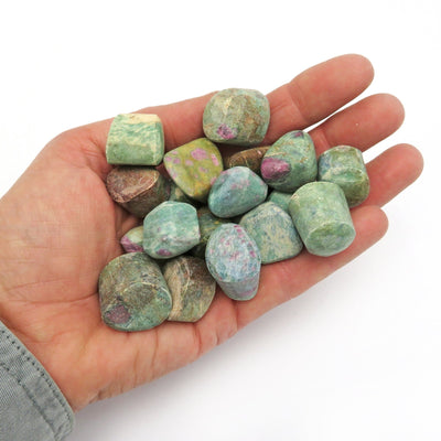 ruby fuchsite tumbled in a hand