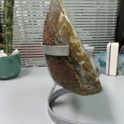 Back view of an amethyst geode formation showing it is brown on the backside.