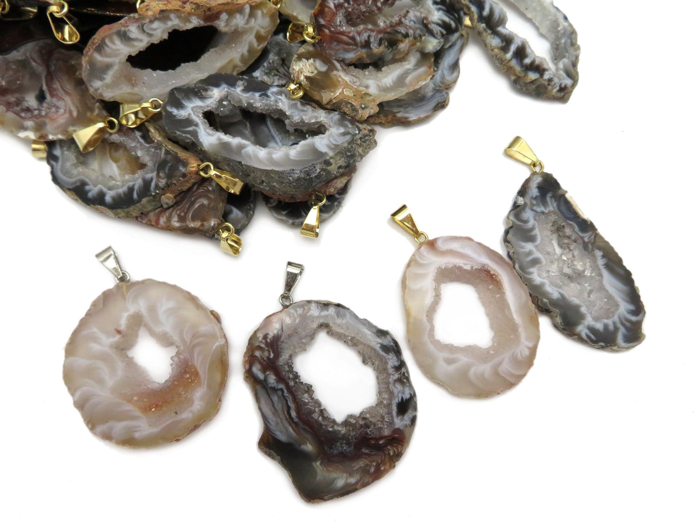 Agate Geode Natural Druzy Pendants shown with silver and gold bails.