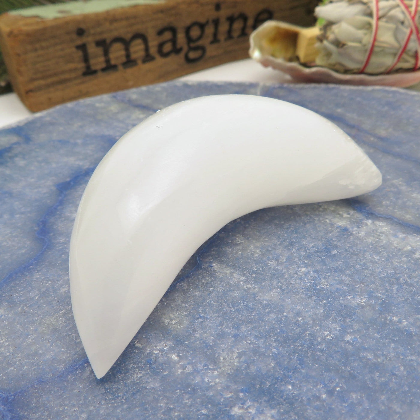 close up of selenite crescent moon for details